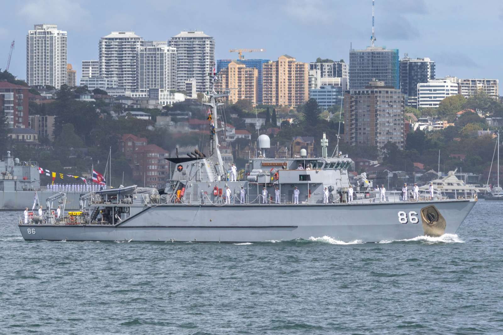 Royal Australian Navy patrol boat under way in Sydney Harbour, representing security officer responsibilities for DISP members.